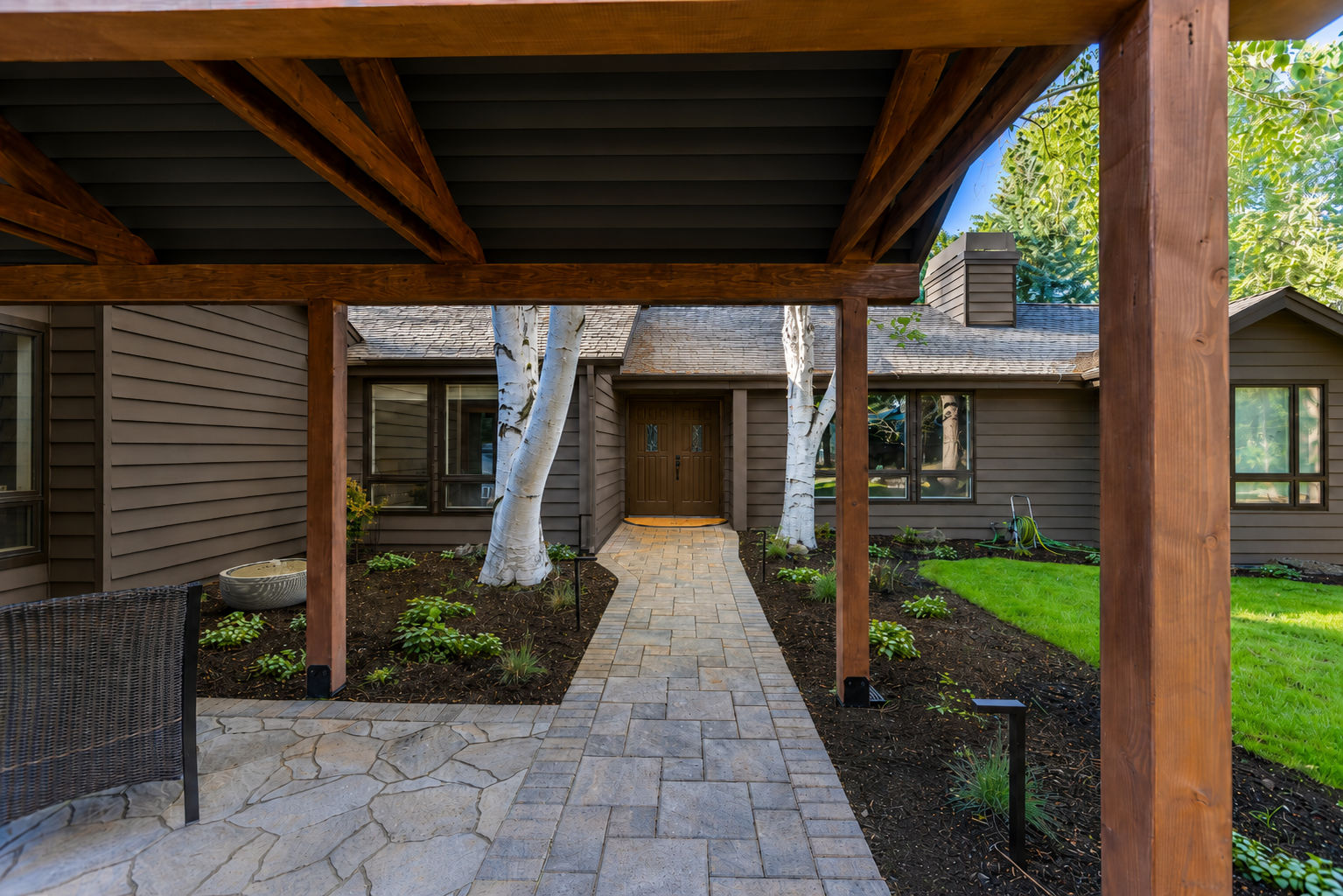 Mountain High — view from under cedar pergola down paver walkway to front door