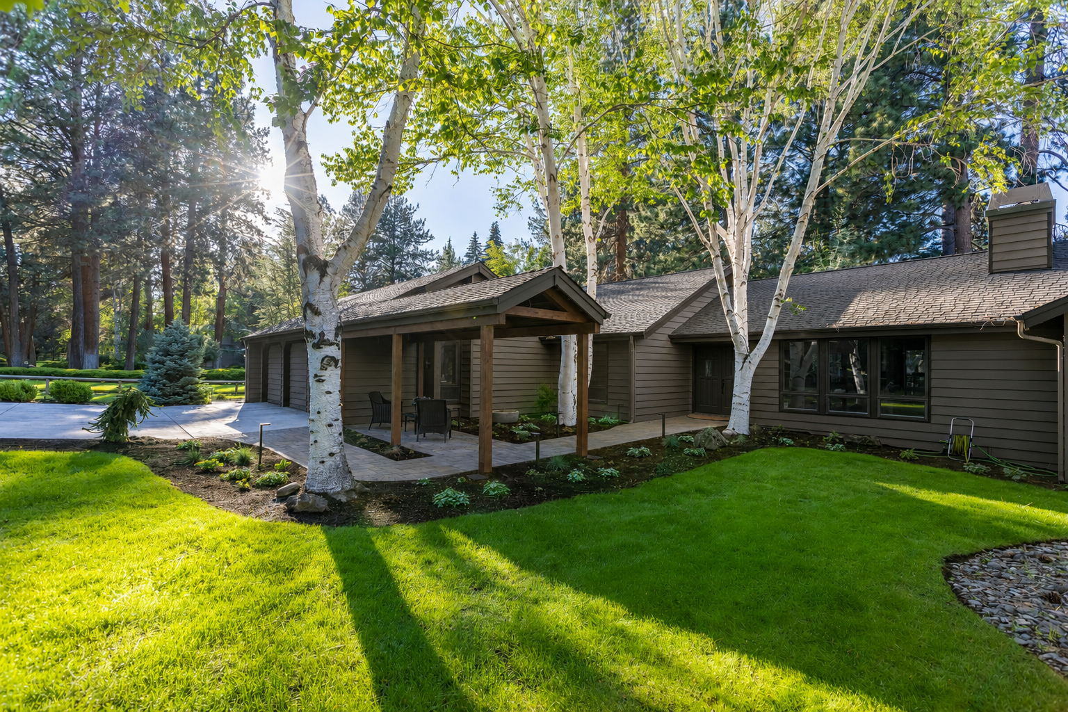 Mountain High — covered patio area with fountain bowl and ornamental plantings