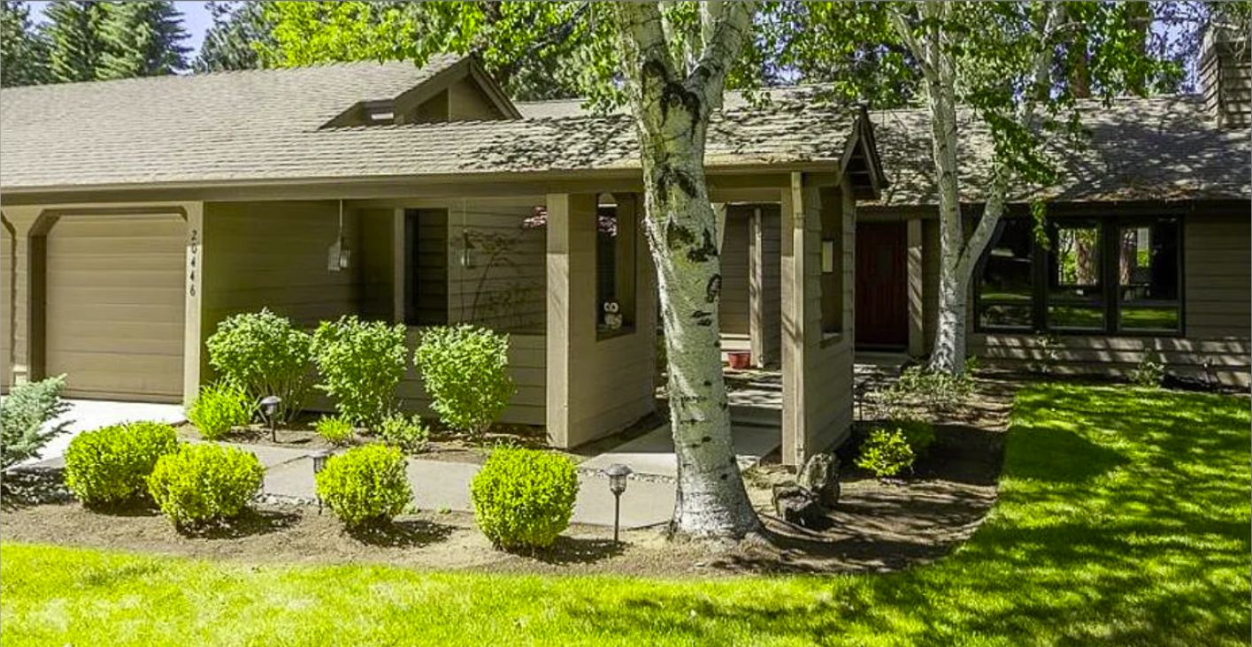 Mountain High entry before — original concrete walkway, boxwood shrubs, no pergola