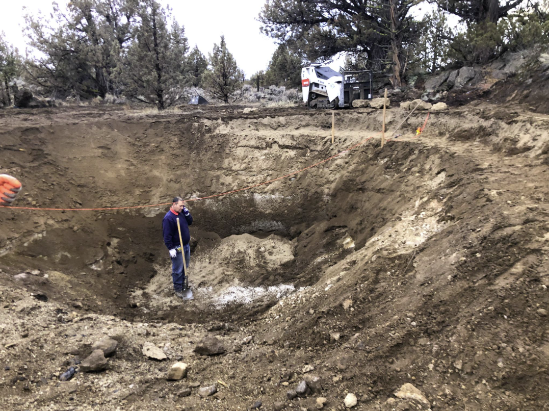 East Bend — construction: pond excavation with worker in pit