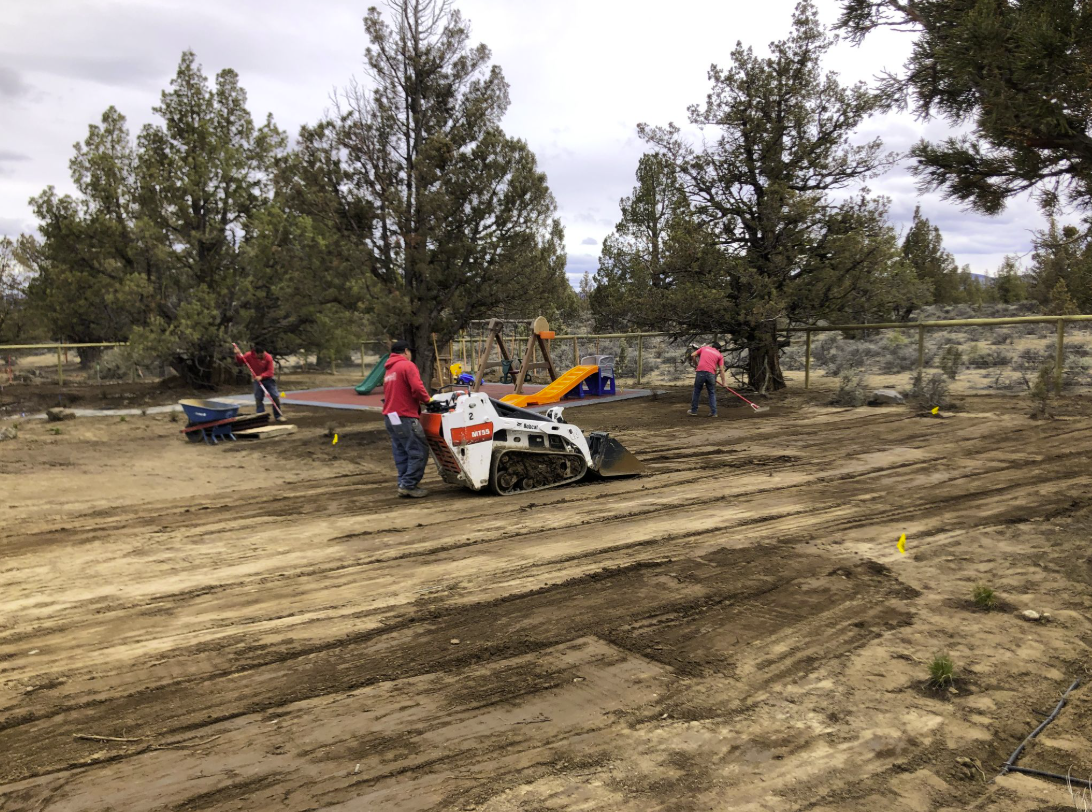 East Bend — construction: bobcat grading with crew raking