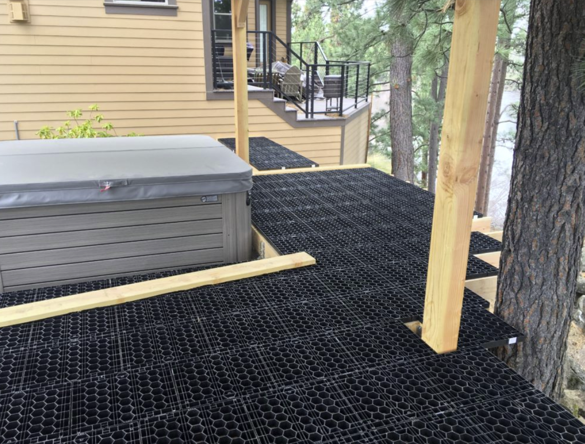 Hot tub and deck with paver grid substrate