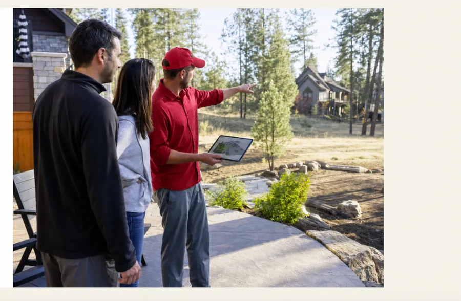 Landscape designer consultation with homeowners in Central Oregon backyard