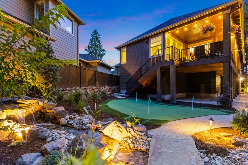 NW Bend backyard pondless water feature pathway with lighting, view 2 — Bend, OR